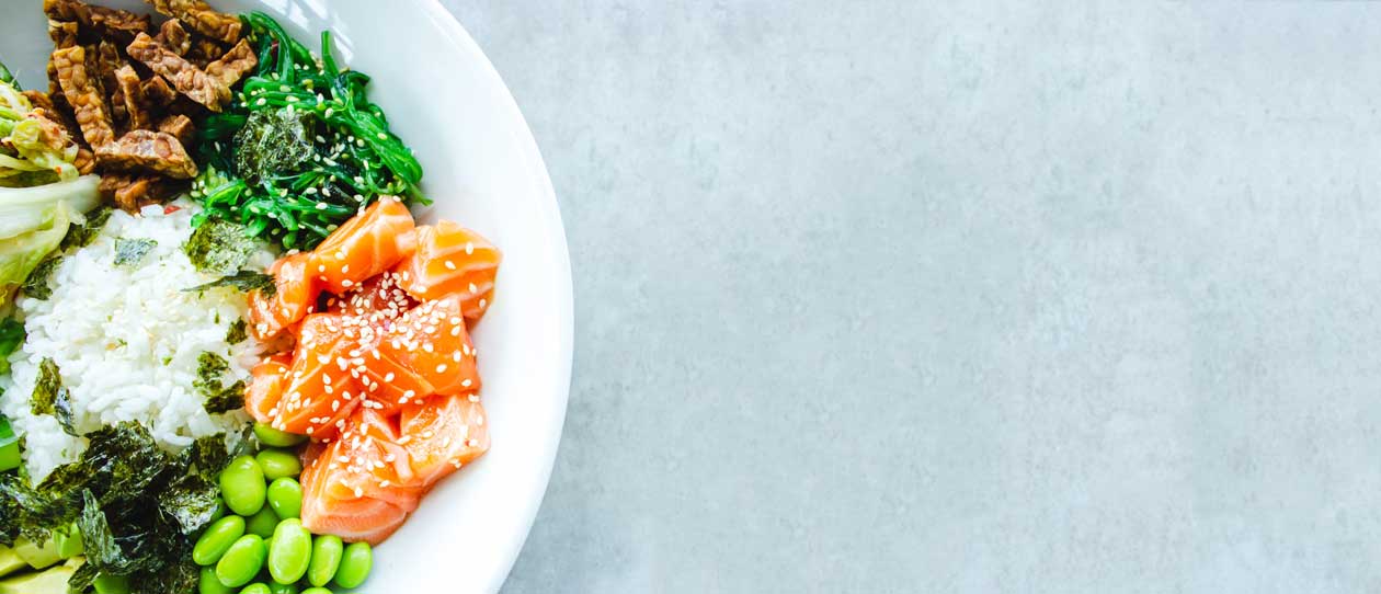 Bowl with salmon, tempeh and greens