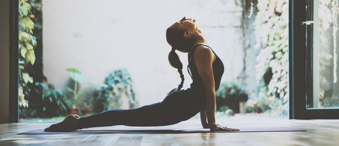 Woman doing an upward dog yoga pose