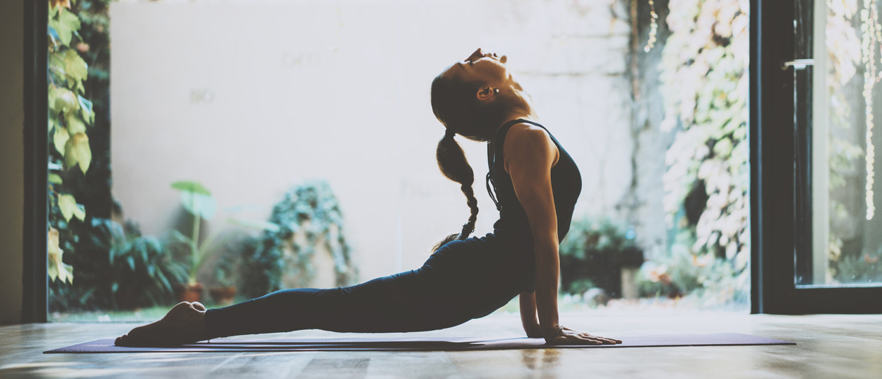 Woman doing an upward dog yoga pose