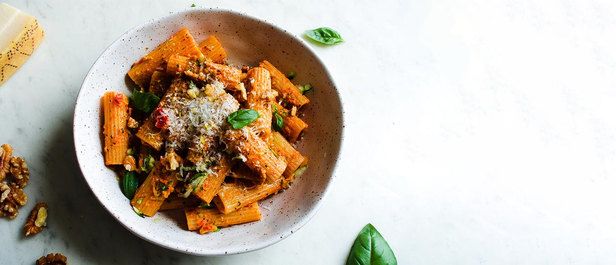 Bowl of pasta with sun-dried tomato pesto