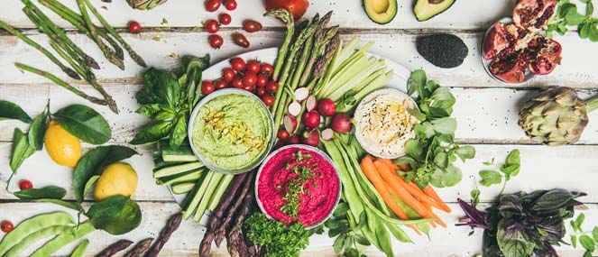 Platter with asparagus, artichoke, beetroot, hommus and fresh vegetables