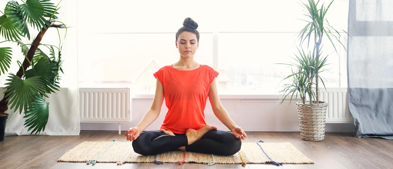 Woman meditating in the lotus position